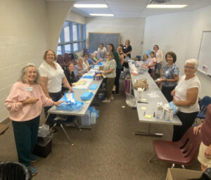 Group putting together birthing kits