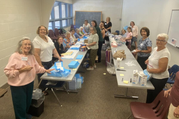 Group putting together birthing kits